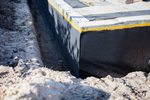 Professional Waterproofing technician working in Adrian, MN